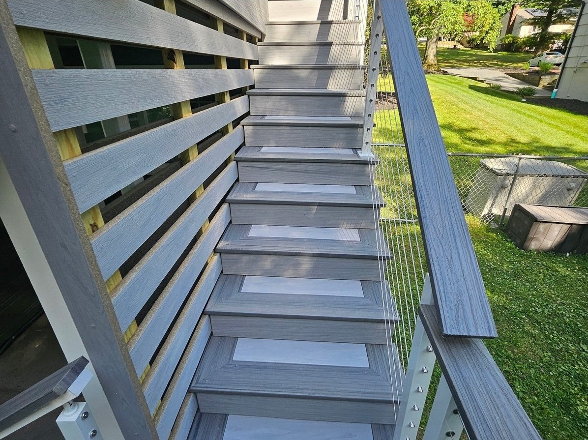 Composite stair and horizontal skirt detail leading from the deck.